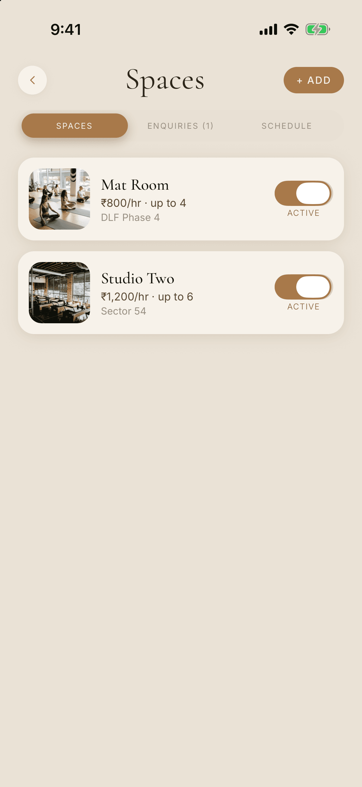 Spaces screen listing two rentable rooms, Mat Room and Studio Two, each with a photo, hourly price, capacity and an Active switch.